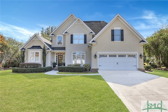 view of front facade featuring a front yard and a garage