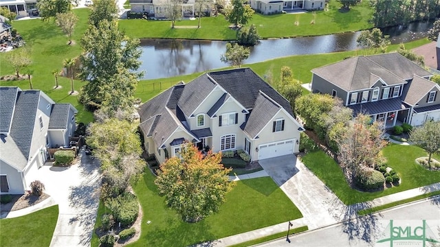 bird's eye view featuring a water view and a residential view