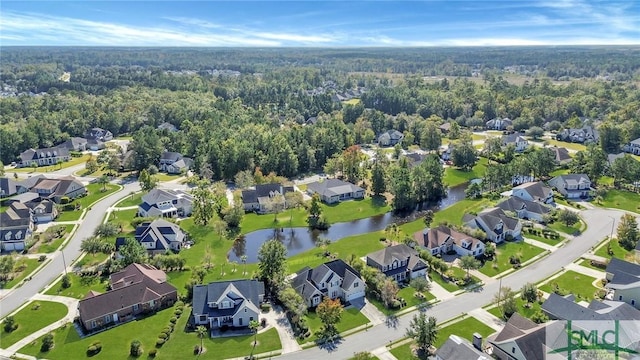 aerial view with a water view, a residential view, and a view of trees