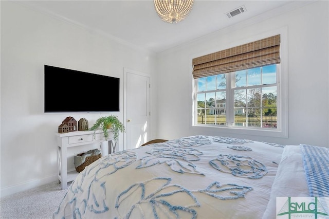 carpeted bedroom featuring visible vents and baseboards