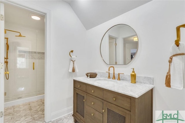 full bathroom featuring baseboards, tile patterned floors, vaulted ceiling, vanity, and a shower stall