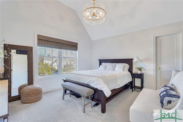 carpeted bedroom with a chandelier and high vaulted ceiling