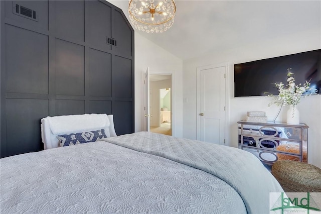 bedroom featuring visible vents, vaulted ceiling, and a notable chandelier