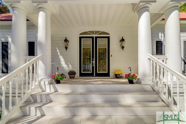 doorway to property featuring covered porch