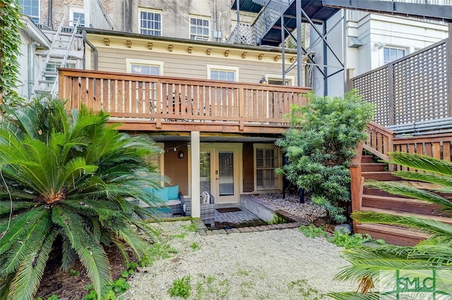 back of house with a wooden deck