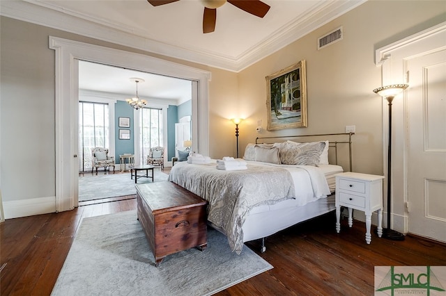 bedroom with ceiling fan, dark wood-type flooring, and ornamental molding