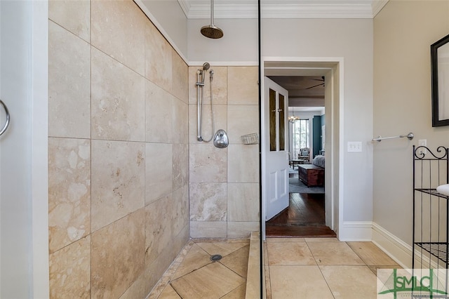 bathroom featuring tile patterned floors, a tile shower, and ornamental molding