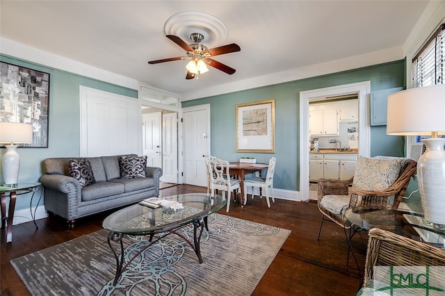 living room with ceiling fan, dark wood-type flooring, and sink