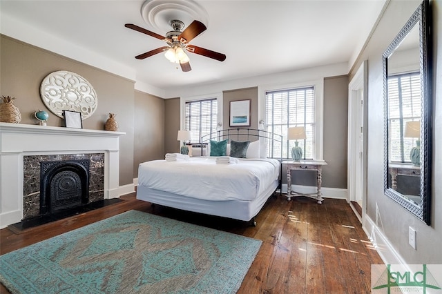 bedroom featuring dark hardwood / wood-style floors and ceiling fan