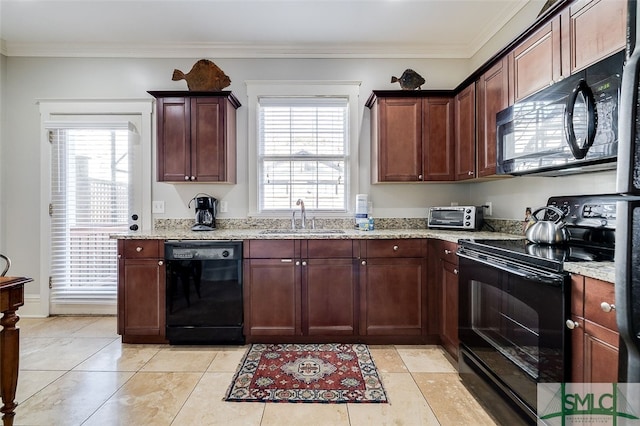 kitchen featuring sink, light stone counters, ornamental molding, and black appliances