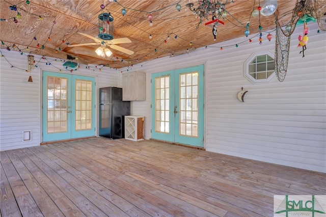 interior space with french doors and ceiling fan