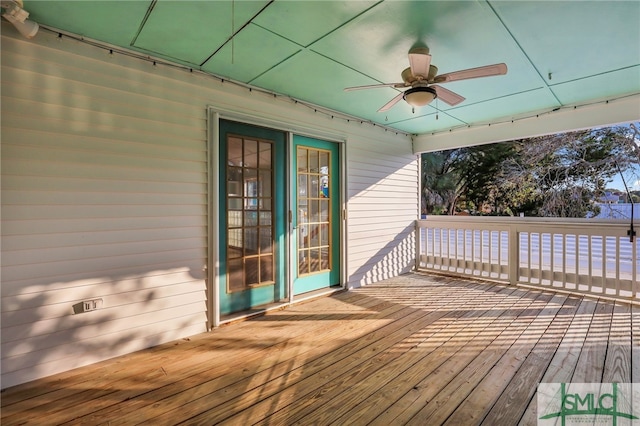 wooden terrace featuring ceiling fan