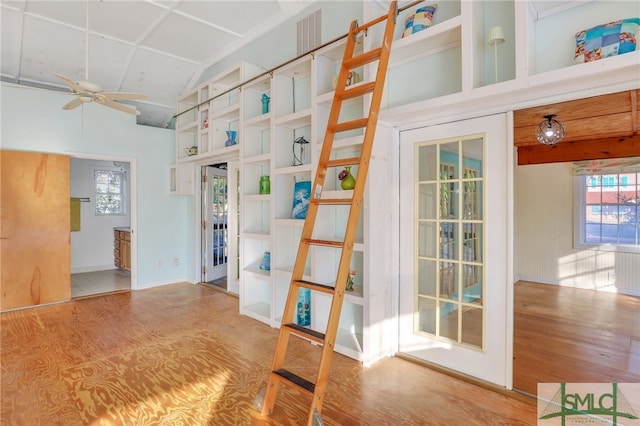 interior space featuring lofted ceiling, hardwood / wood-style flooring, and ceiling fan