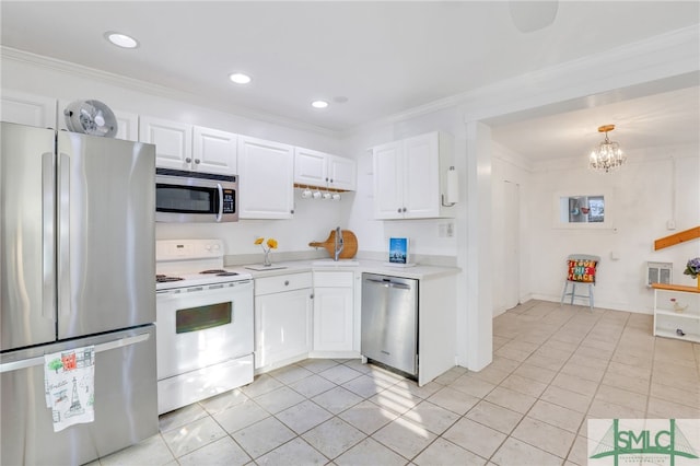 kitchen featuring ornamental molding, white cabinetry, and stainless steel appliances