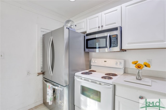 kitchen featuring crown molding, appliances with stainless steel finishes, and white cabinetry