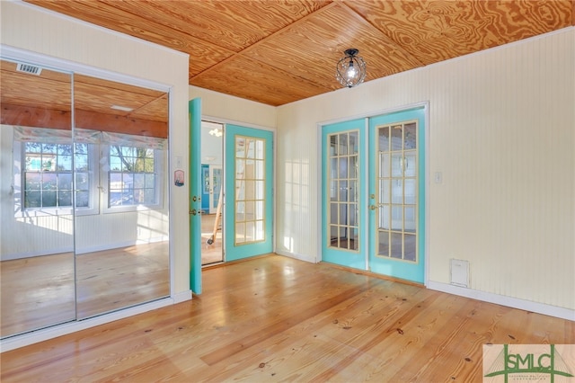 interior space featuring french doors, wood ceiling, and wood-type flooring