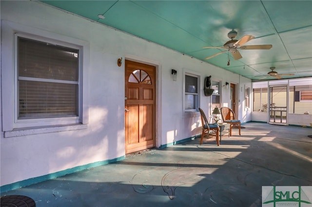 doorway to property with a patio and ceiling fan