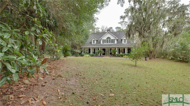 view of front facade with a porch and a front lawn