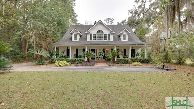 view of front of house featuring a front yard and covered porch