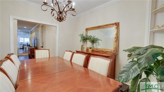 dining room featuring a notable chandelier and ornamental molding