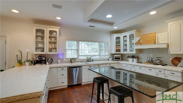 kitchen with dishwasher, sink, white cabinets, crown molding, and dark wood-type flooring