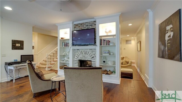 living room with stairway, a fireplace, crown molding, baseboards, and dark wood-style flooring