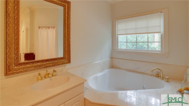 bathroom with a bath and vanity