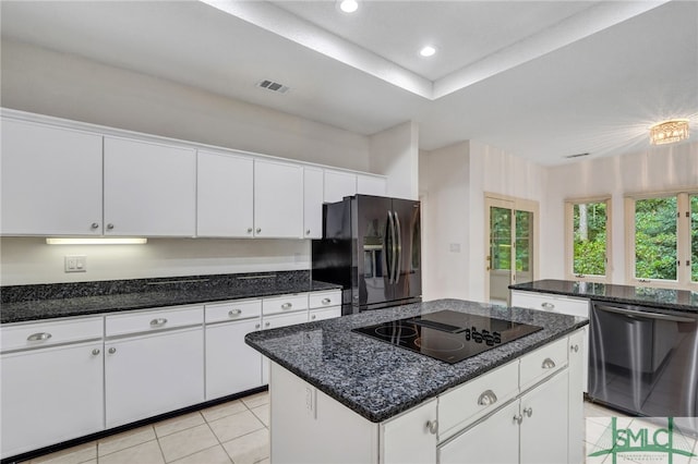 kitchen featuring white cabinetry, black appliances, and a kitchen island