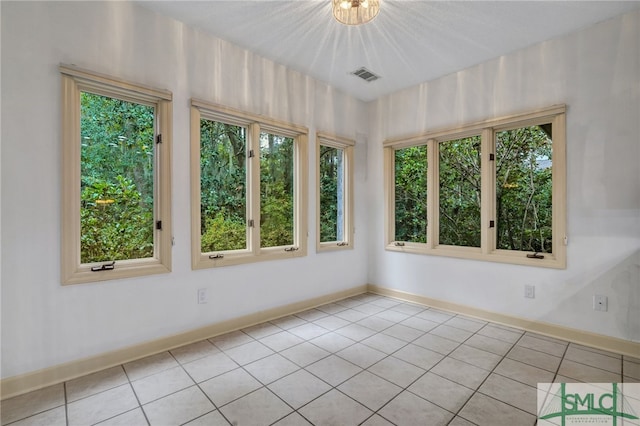 unfurnished sunroom with an inviting chandelier and a healthy amount of sunlight