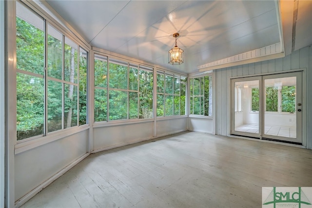 unfurnished sunroom with plenty of natural light