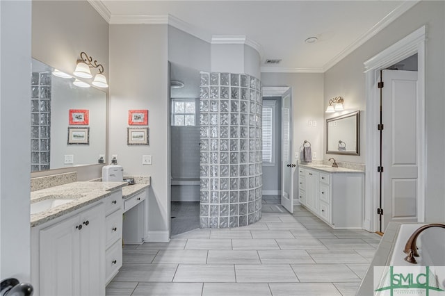 full bathroom with a sink, visible vents, a walk in shower, and crown molding