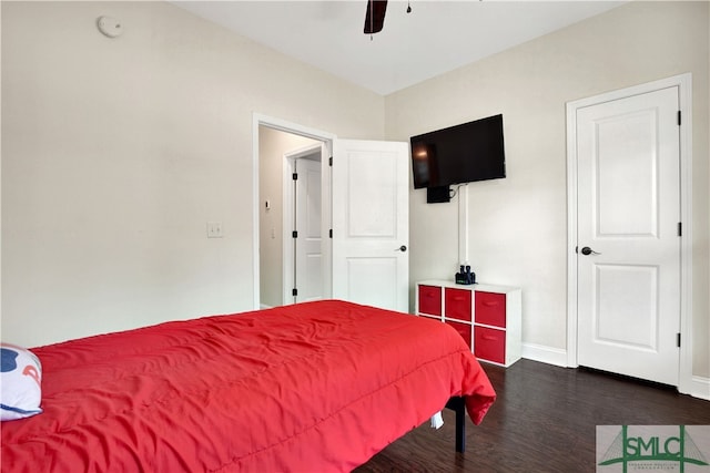 bedroom featuring ceiling fan and dark hardwood / wood-style flooring