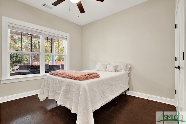 bedroom featuring ceiling fan and dark hardwood / wood-style flooring