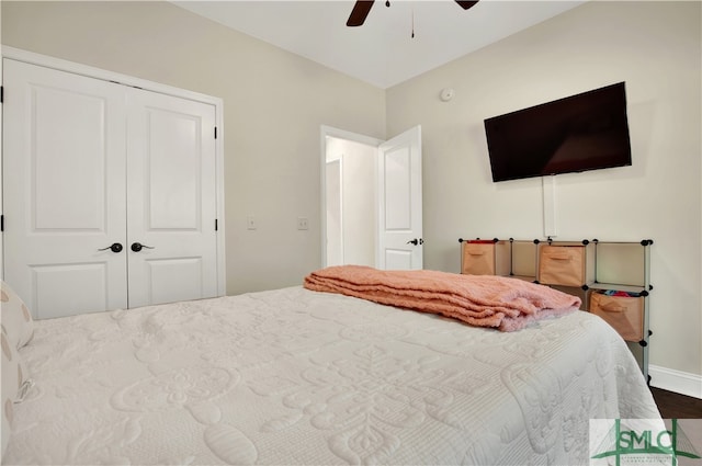 bedroom featuring a closet, hardwood / wood-style floors, and ceiling fan