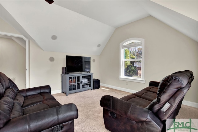 living room featuring lofted ceiling and light colored carpet