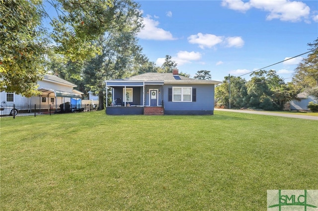 bungalow-style house with a front lawn