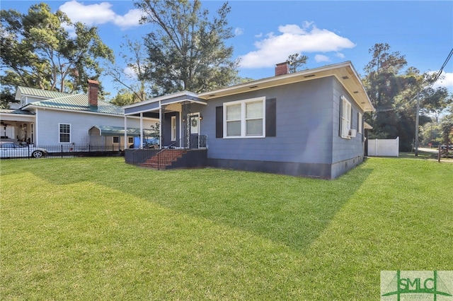 view of front of property featuring cooling unit and a front lawn