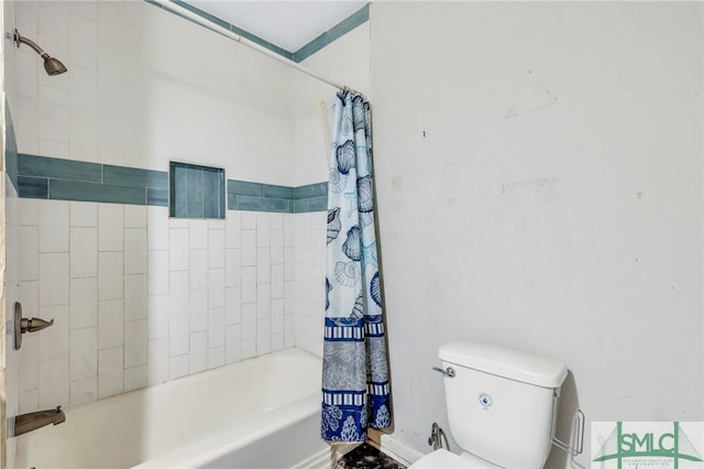 bathroom featuring toilet and shower / tub combo