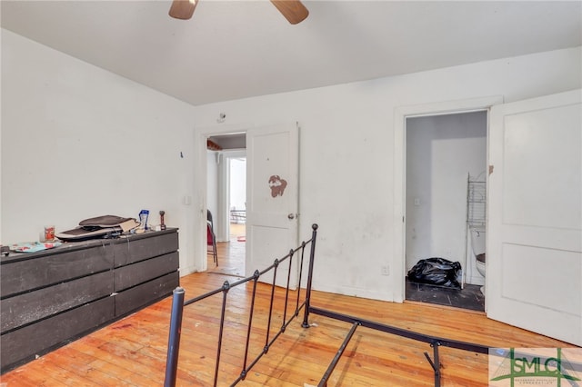 bedroom with ceiling fan and hardwood / wood-style flooring