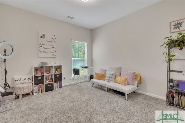 sitting room with carpet flooring