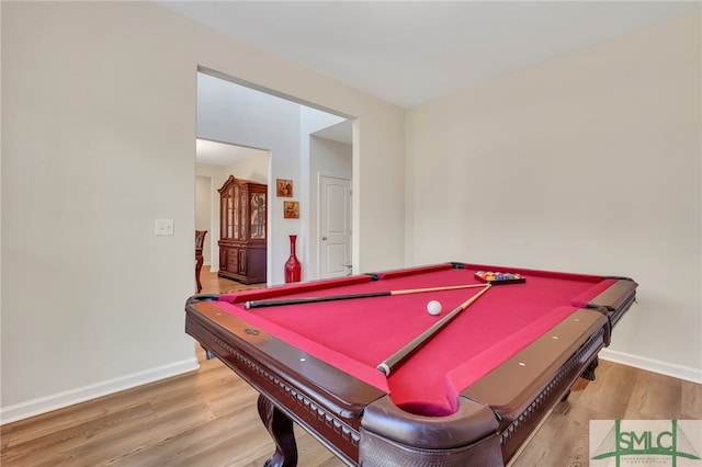 game room with hardwood / wood-style floors and billiards