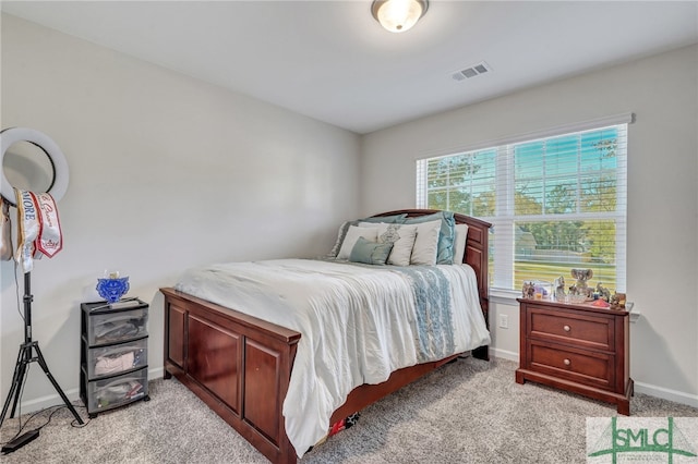 bedroom with light colored carpet