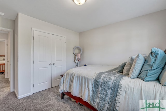 carpeted bedroom with a closet