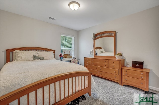 bedroom featuring light carpet