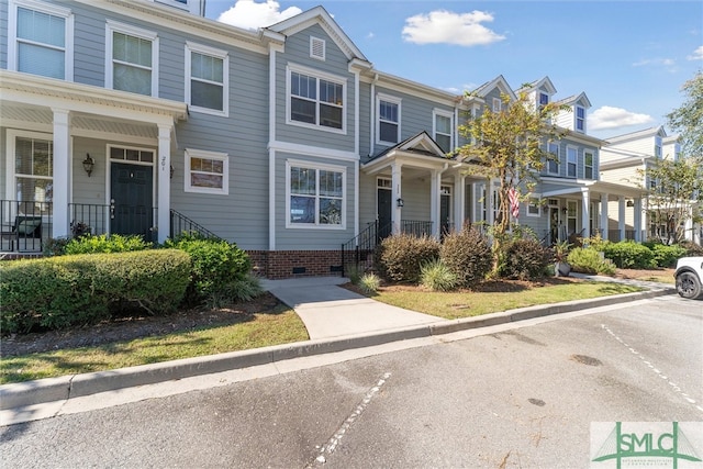 townhome / multi-family property with covered porch