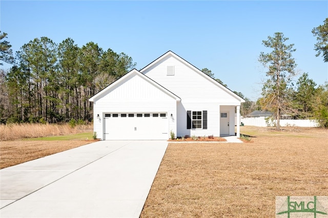 modern farmhouse style home with driveway, an attached garage, and a front lawn