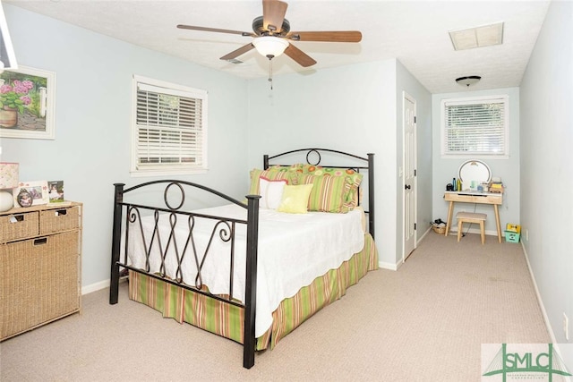 carpeted bedroom featuring ceiling fan