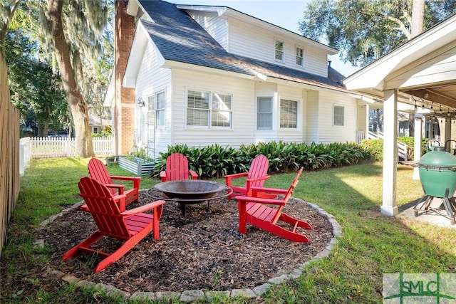 exterior space with an outdoor fire pit