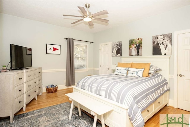 bedroom featuring hardwood / wood-style flooring and ceiling fan