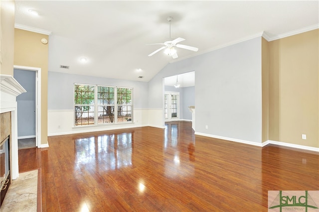 unfurnished living room with ornamental molding, hardwood / wood-style flooring, a fireplace, and ceiling fan